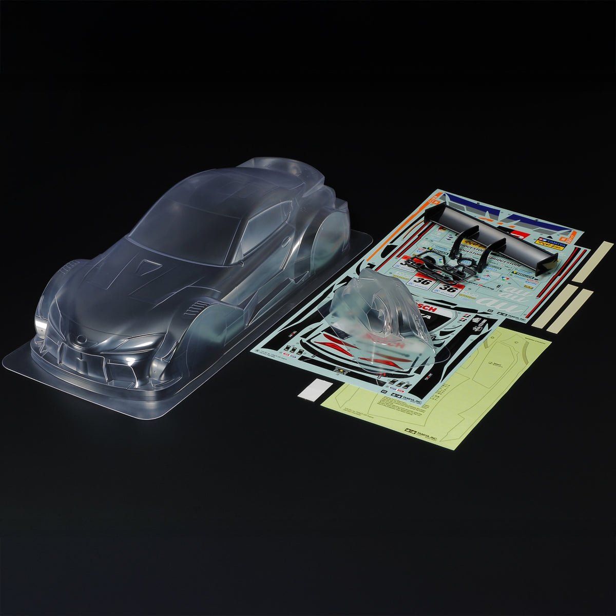 Tamiya RC Body AU TOM's GR Supra w/Parts Set (Clear)
